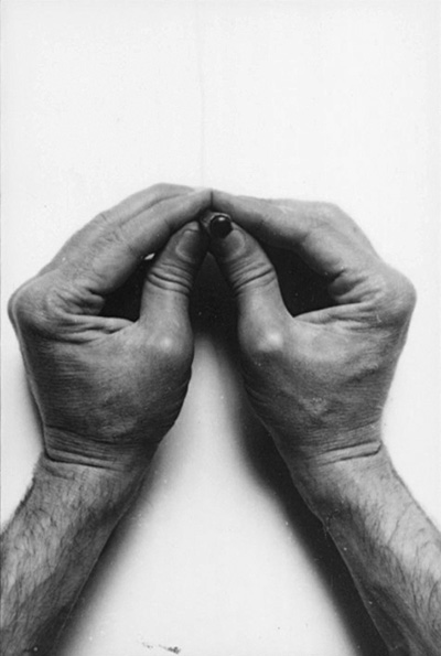 Two hands a pencil, photo by Gianfranco Gorgoni